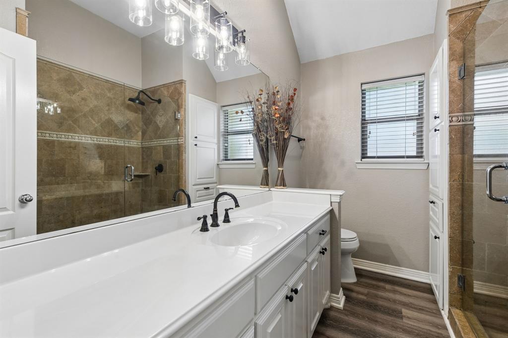 317 Singing Quail Trail Haslet, TX 76052 - Photo 22 of 32 Dual vanity with integrated white sinks and matte black hardware