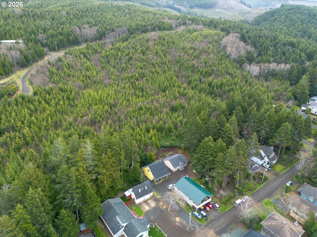 142 South Quadrant Street Rockaway Beach, OR 97136 - Photo 25 of 42 an aerial view of a house with a yard