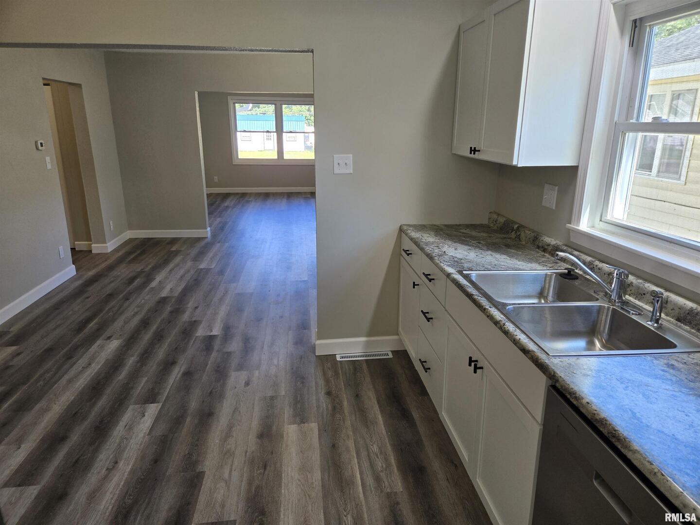713 North 8th Street Herrin, IL 62948 - Photo 10 of 22 a kitchen that has a sink and a stove