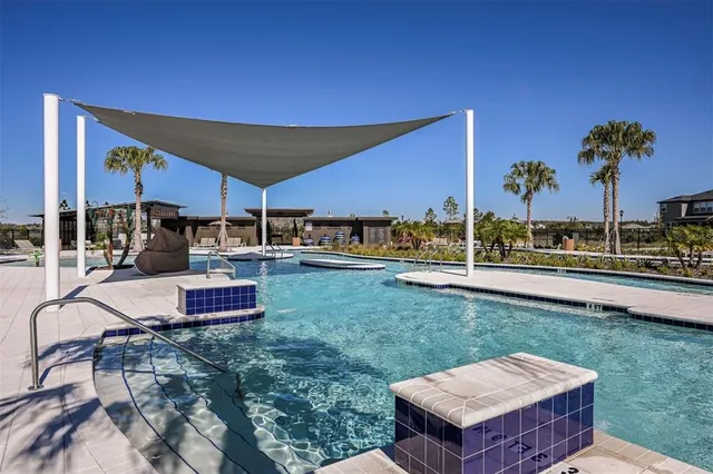 a view of a backyard with sitting area