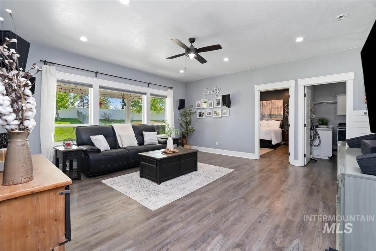 15015 Leon Lane Caldwell, ID 83607 - Photo 12 of 44 Spacious living area featuring wood-finish flooring, recessed lighting, and a ceiling fan