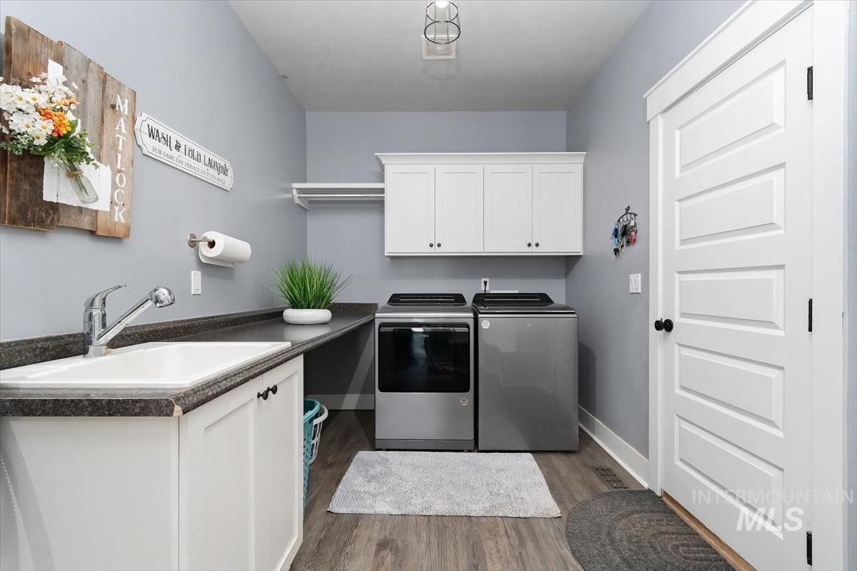 15015 Leon Lane Caldwell, ID 83607 - Photo 16 of 44 Dedicated laundry room with wood-finish flooring