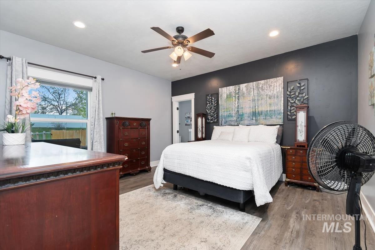 15015 Leon Lane Caldwell, ID 83607 - Photo 18 of 44 Bedroom featuring wood-finish flooring, recessed lighting, and a ceiling fan
