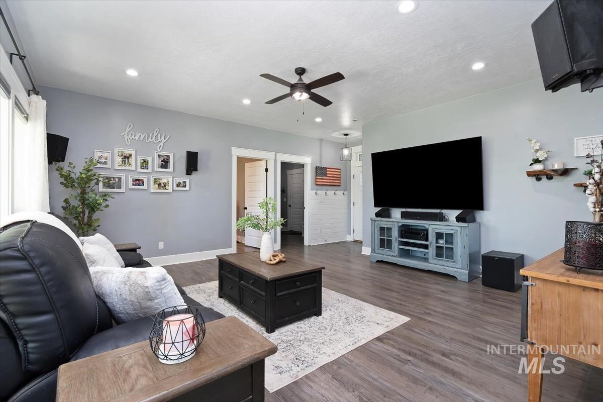 15015 Leon Lane Caldwell, ID 83607 - Photo 25 of 44 Spacious living area featuring wood-finish flooring, recessed lighting, and a ceiling fan
