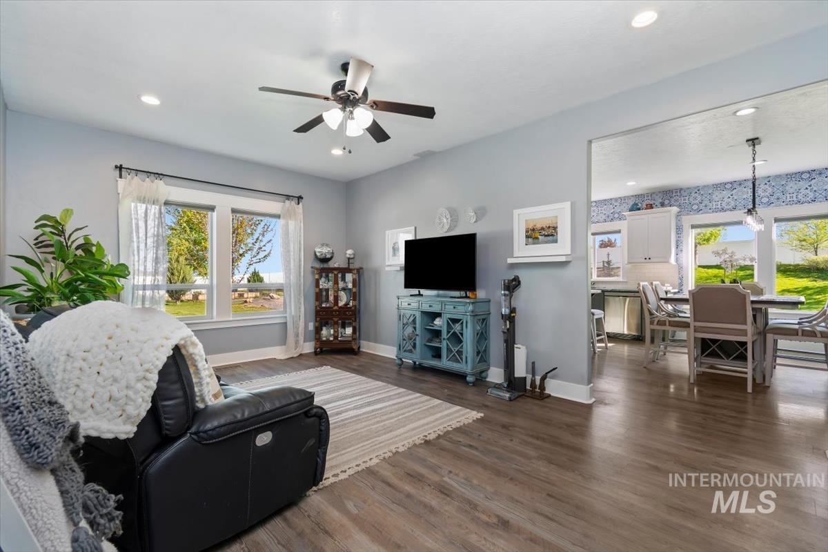 15015 Leon Lane Caldwell, ID 83607 - Photo 26 of 44 Open-concept living space featuring wood-finish flooring, recessed lighting, and a ceiling fan