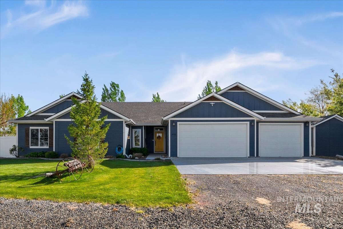 15015 Leon Lane Caldwell, ID 83607 - Photo 43 of 44 Contemporary ranch-style exterior featuring deep blue siding and white trim