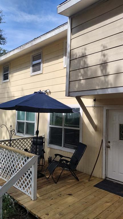 304 Ridgewood Drive Tool, TX 75143 - Photo 4 of 12 a view of a patio with table and chairs under an umbrella