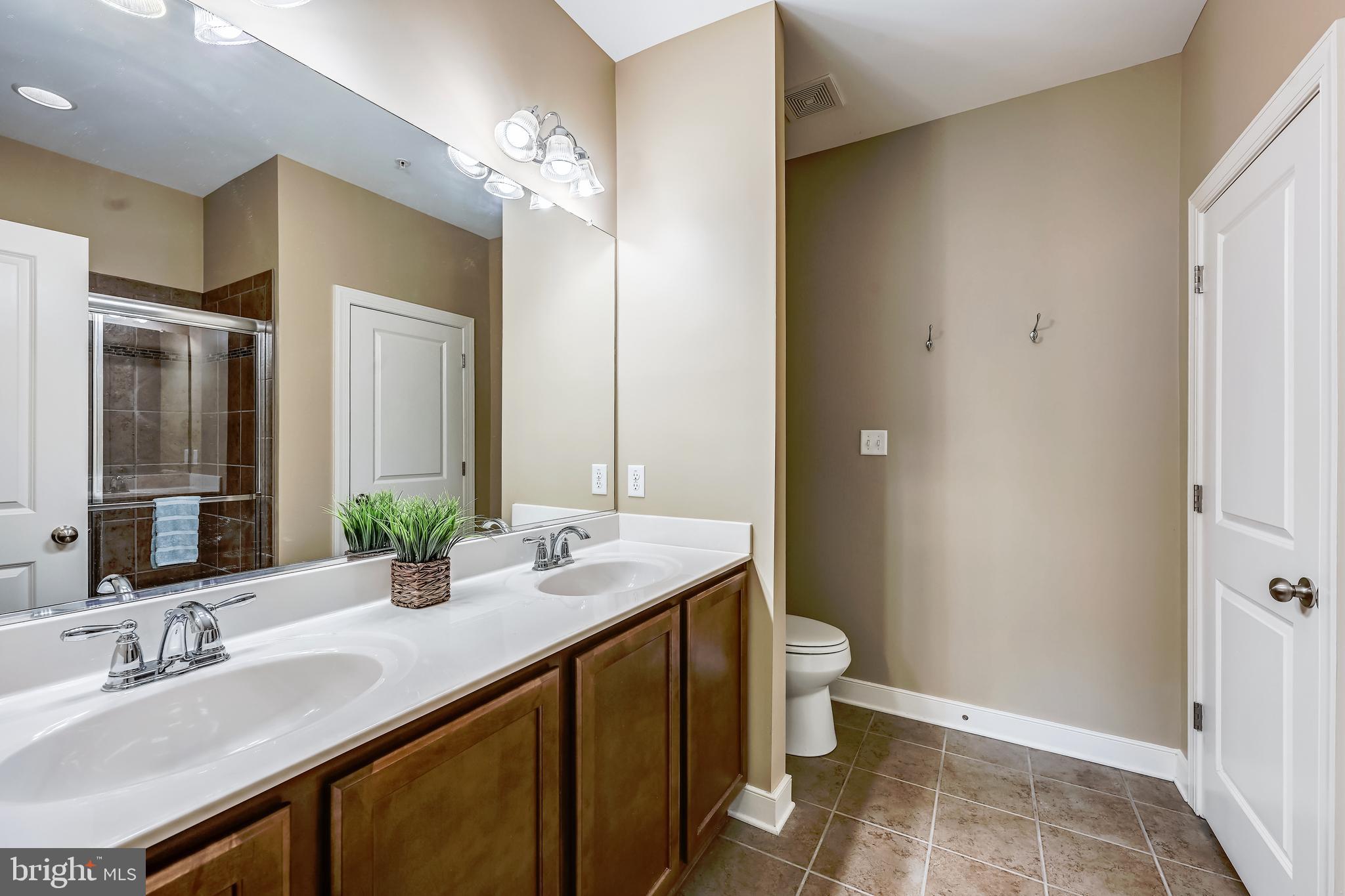 24 Trail Ride Drive, Unit 435 Taneytown, MD 21787 - Photo 23 of 61 OWNER'S BTHRM W/ DOUBLE SINKS & LARGE LINEN CLOSET