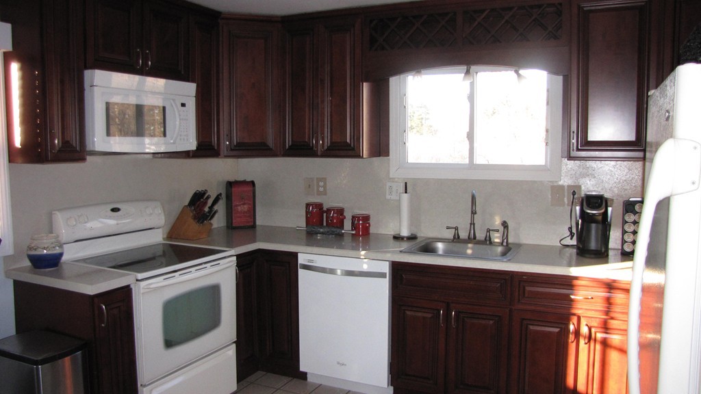 50 Rochford Circle Springfield, MA 01128 - Photo 13 of 23 a kitchen with a sink cabinets and window