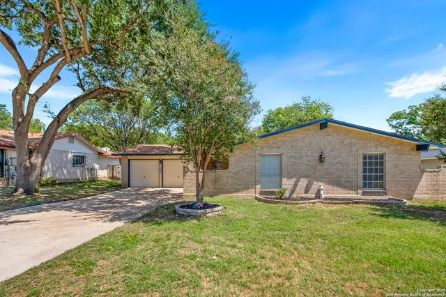 a front view of house with yard and seating area