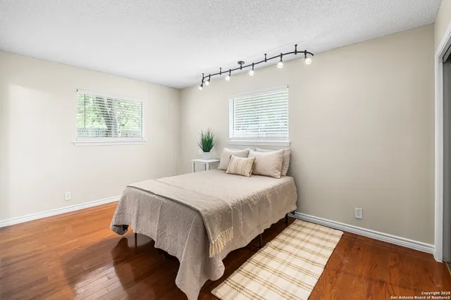 a bedroom with a bed and window