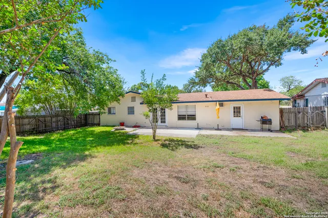 a view of a house with a back yard