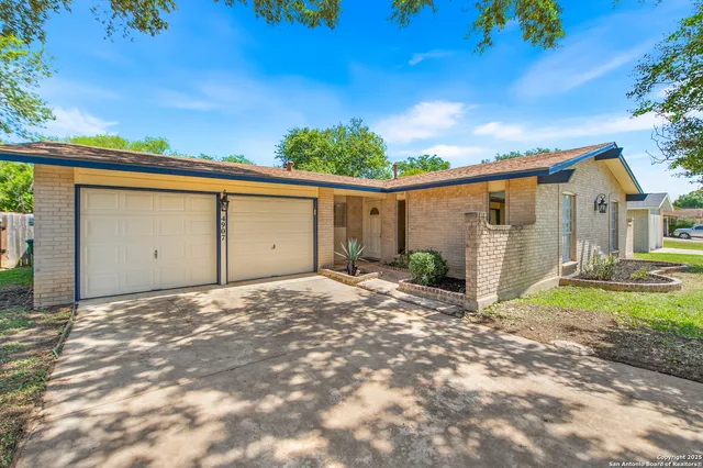 a backyard of a house with yard and garage