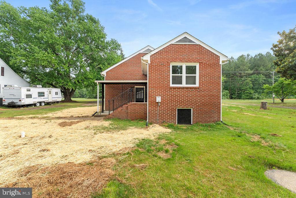 10221 Dahlgren Road King George, VA 22485 - Photo 28 of 31 a front of a house with a yard