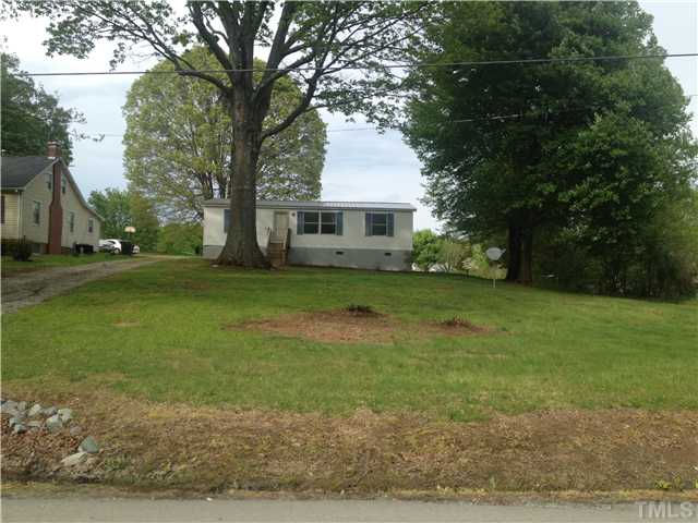 4491 Oxford Road Roxboro, NC 27574 - Photo 11 of 11 a view of a house with a yard