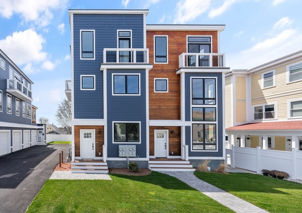 120 School Street, Unit 3 Boston, MA 02119 - Photo 1 of 30 a front view of a house with a yard