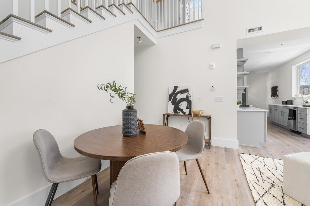 120 School Street, Unit 3 Boston, MA 02119 - Photo 11 of 30 a dining room with furniture and wooden floor