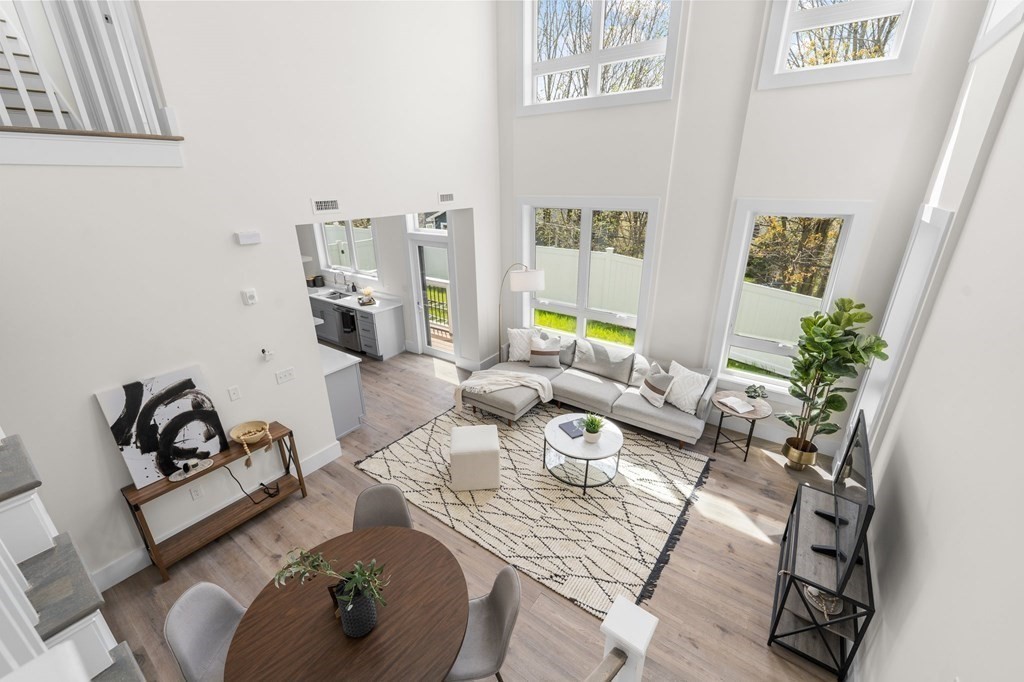 120 School Street, Unit 3 Boston, MA 02119 - Photo 13 of 30 a living room with furniture and wooden floor