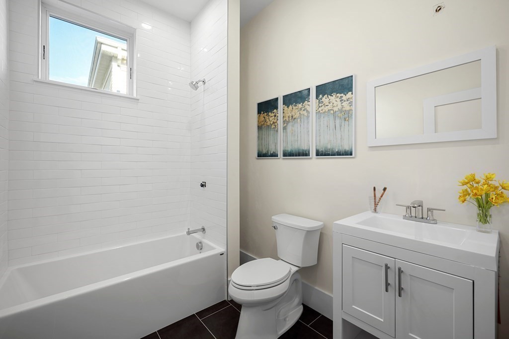 120 School Street, Unit 3 Boston, MA 02119 - Photo 18 of 30 a bathroom with a sink toilet and bathtub