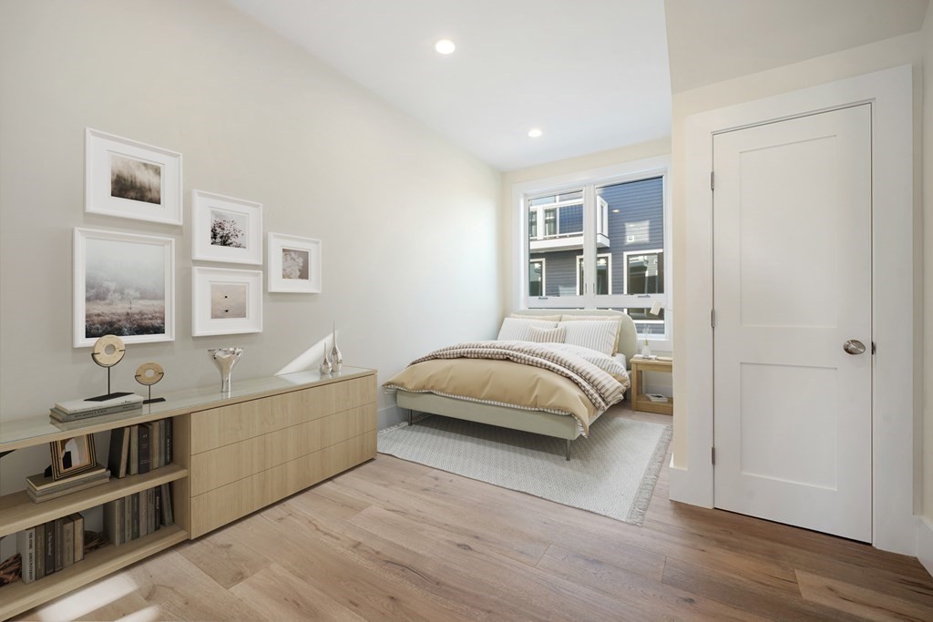 120 School Street, Unit 3 Boston, MA 02119 - Photo 19 of 30 a bedroom with a bed and a window