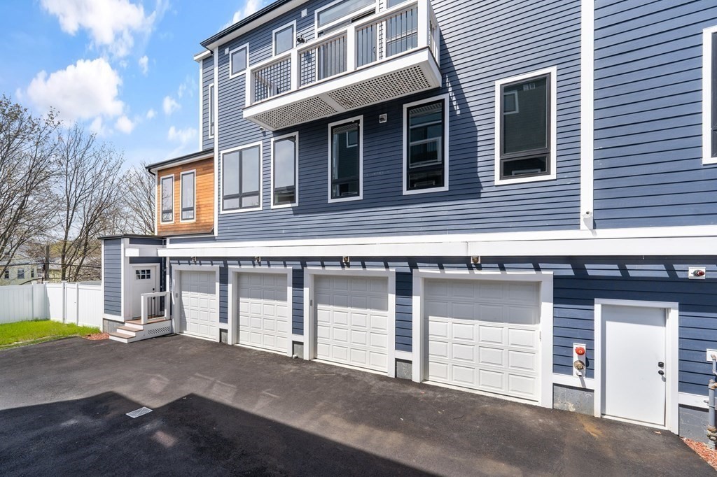120 School Street, Unit 3 Boston, MA 02119 - Photo 24 of 30 a view of a house with more windows and a road