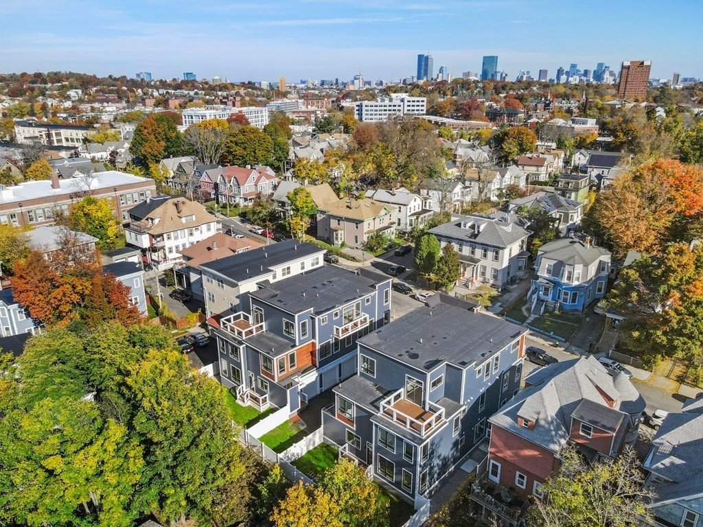 120 School Street, Unit 3 Boston, MA 02119 - Photo 27 of 30 an aerial view of residential houses with outdoor space and trees