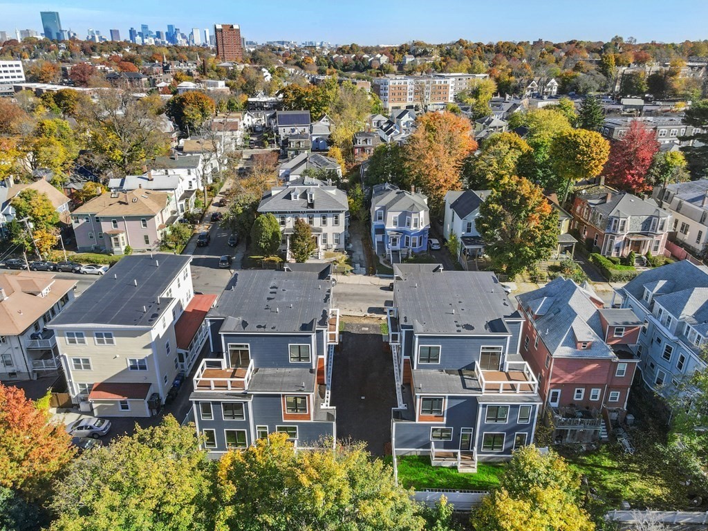 120 School Street, Unit 3 Boston, MA 02119 - Photo 28 of 30 an aerial view of residential houses with outdoor space