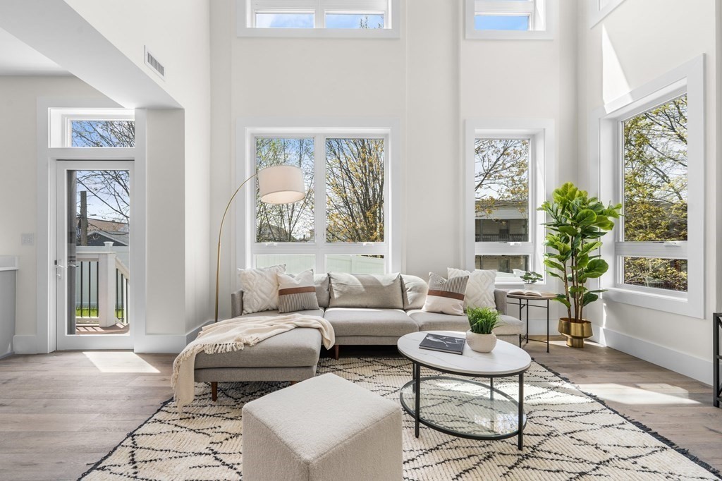120 School Street, Unit 3 Boston, MA 02119 - Photo 3 of 30 a living room with furniture and a window