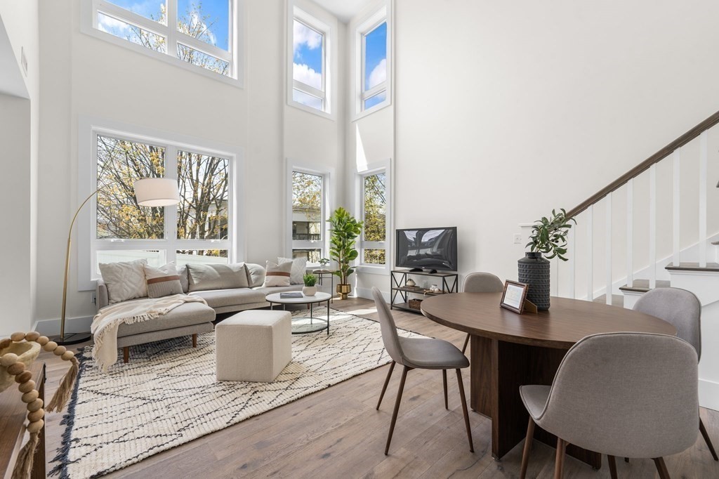 120 School Street, Unit 3 Boston, MA 02119 - Photo 5 of 30 a living room with furniture wooden floor and a table