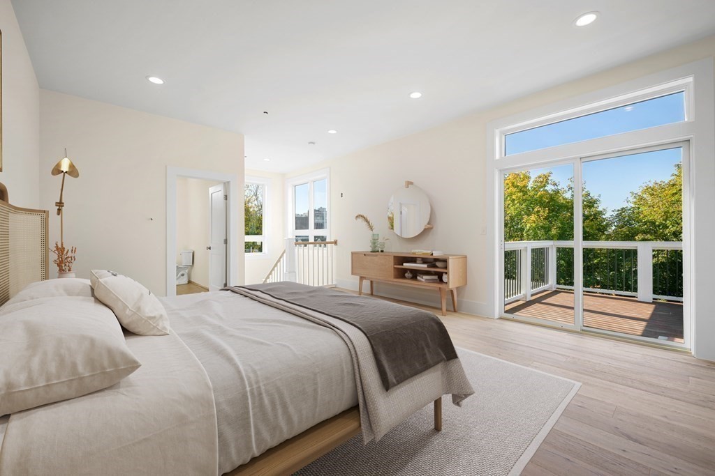 120 School Street, Unit 3 Boston, MA 02119 - Photo 6 of 30 a bedroom with a bed and a large window