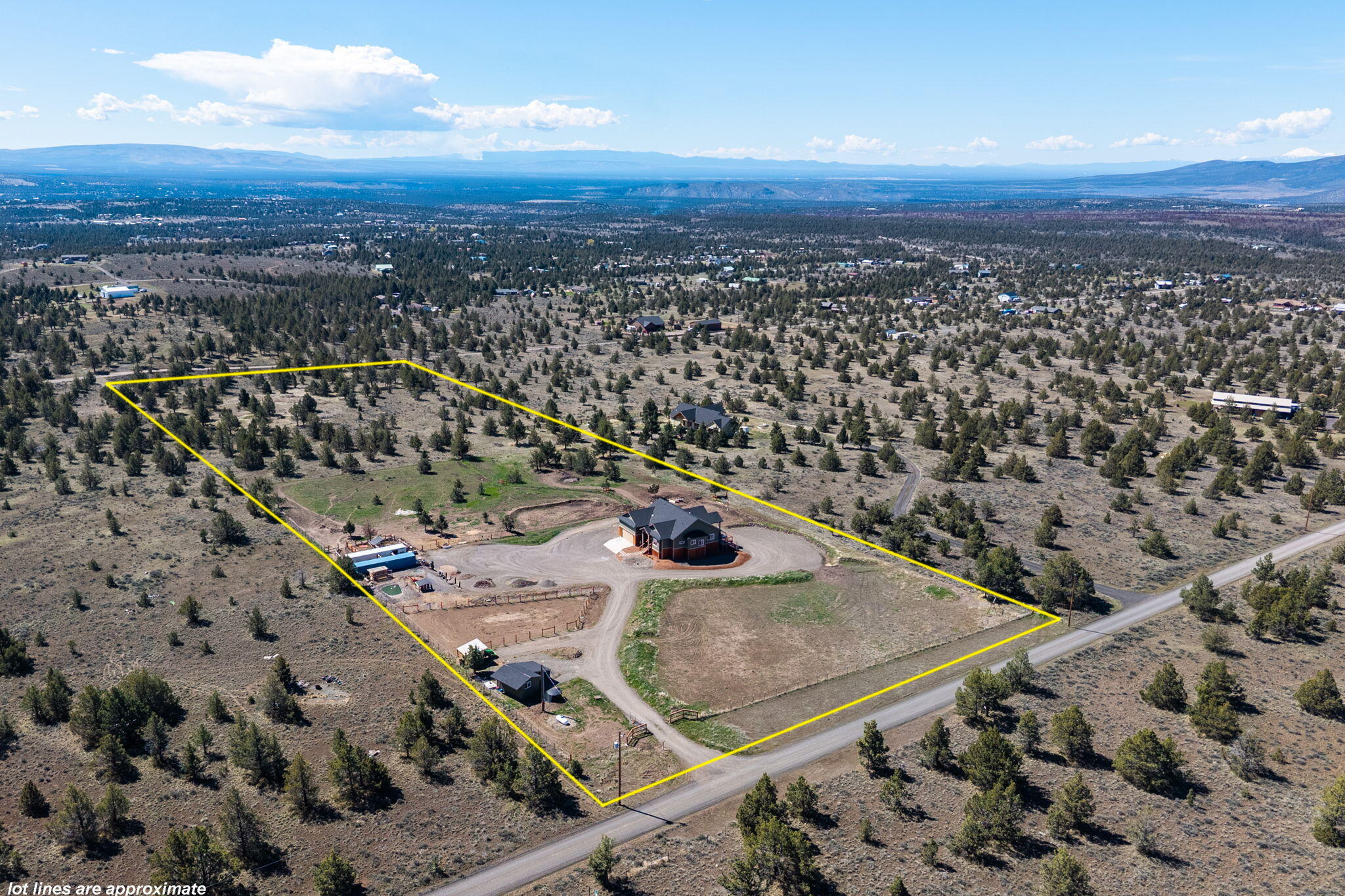 6040 Gravett Road Prineville, OR 97754 - Photo 56 of 77 an aerial view of residential houses with outdoor space