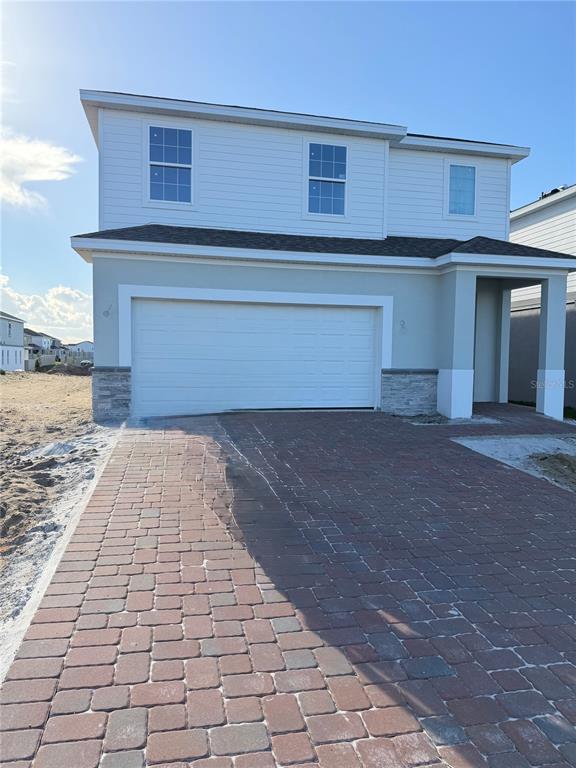 7672 Trapani Loop Clermont, FL 34714 - Photo 1 of 1 a front view of a house with a yard