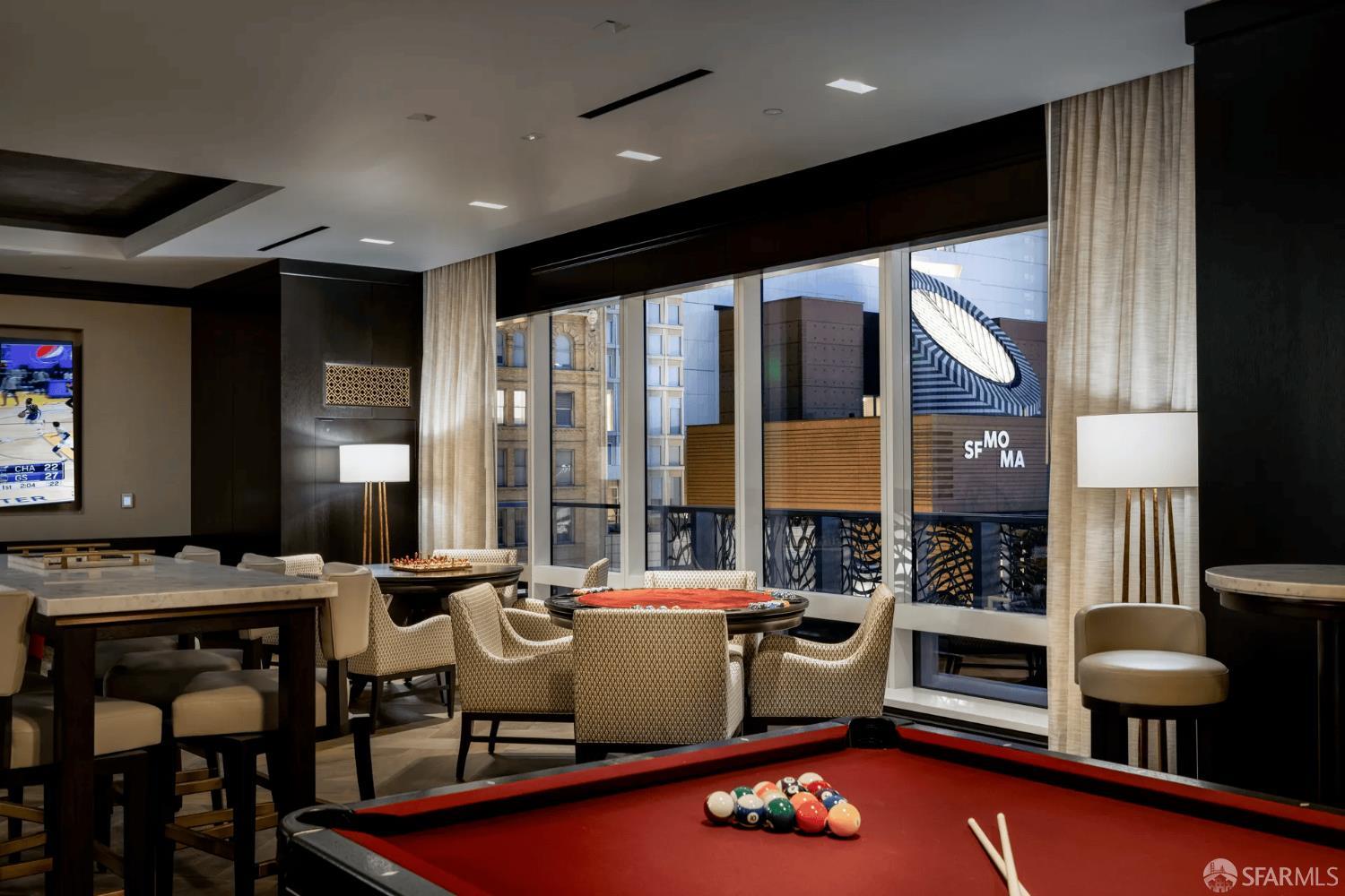 706 Mission Street, Unit 28A San Francisco, CA 94103 - Photo 16 of 30 a kitchen with a table chairs and a large window