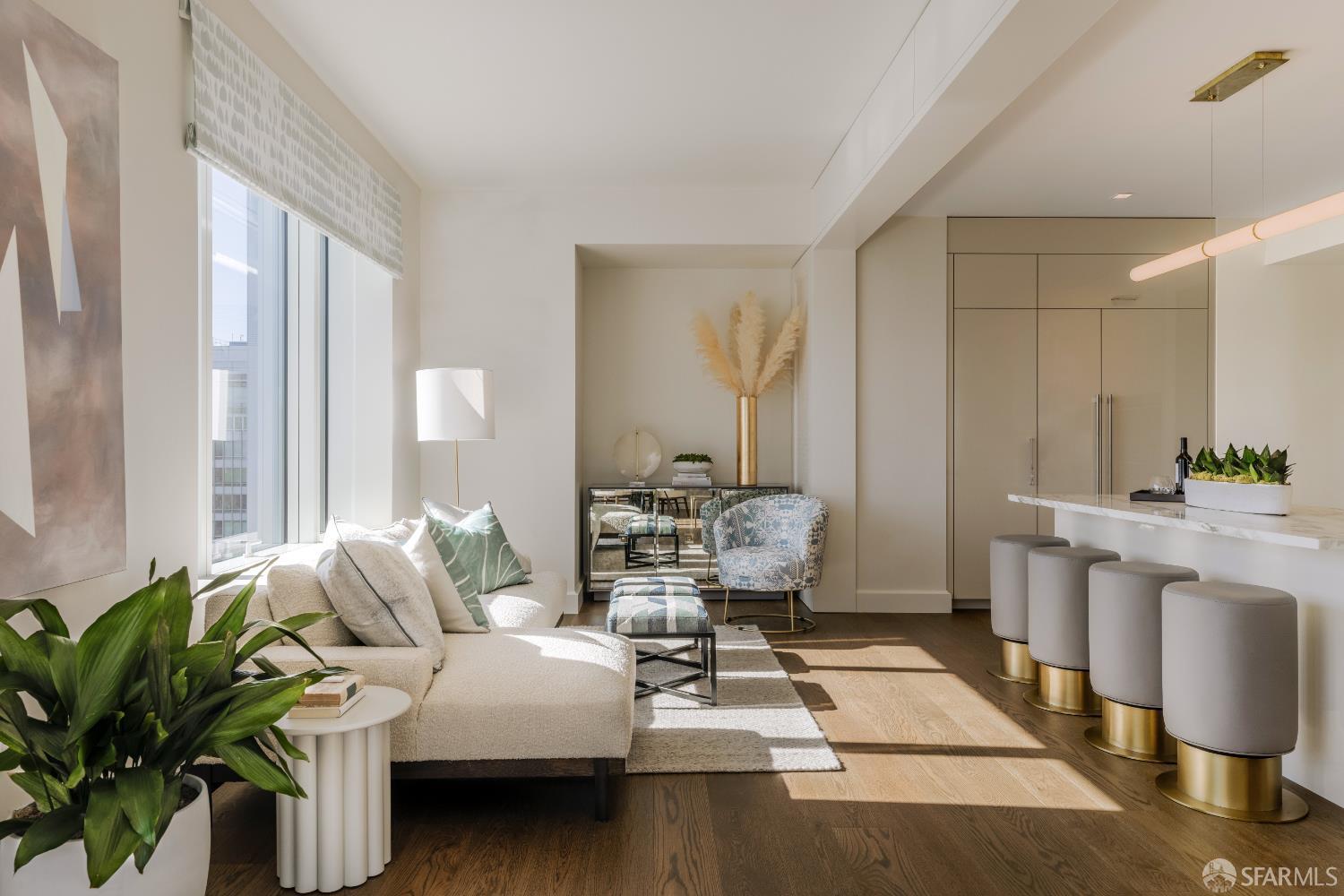 706 Mission Street, Unit 28A San Francisco, CA 94103 - Photo 5 of 30 a living room with furniture floor to ceiling window and potted plant