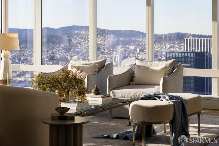 706 Mission Street, Unit 28A San Francisco, CA 94103 - Photo 6 of 30 a balcony with furniture and a floor to ceiling window