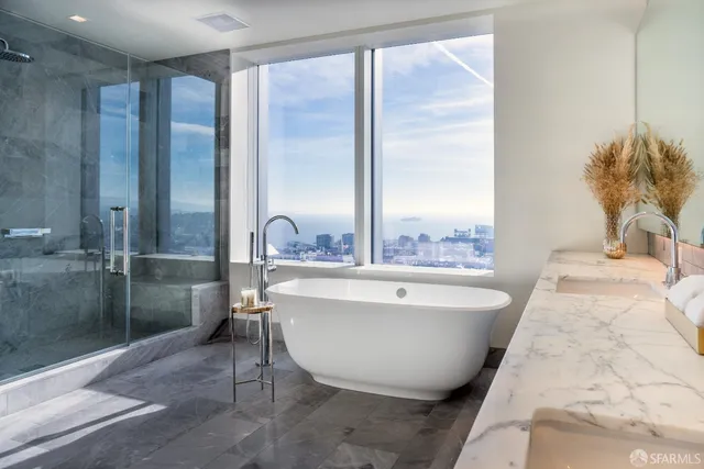 a bathroom with a bathtub and shower