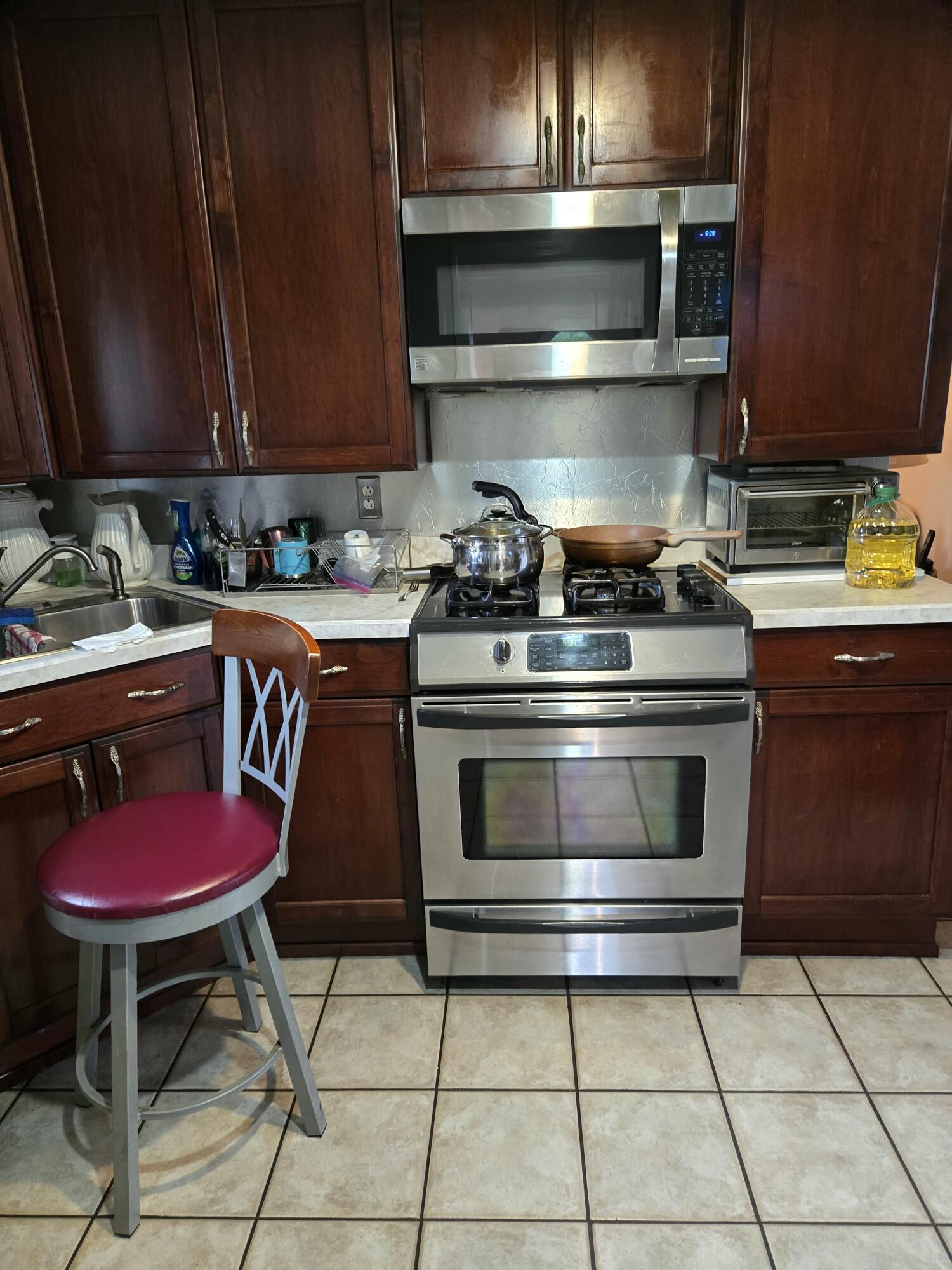 8146 Williamson Road Roanoke, VA 24019 - Photo 4 of 27 a kitchen with stainless steel appliances a stove a sink and cabinets
