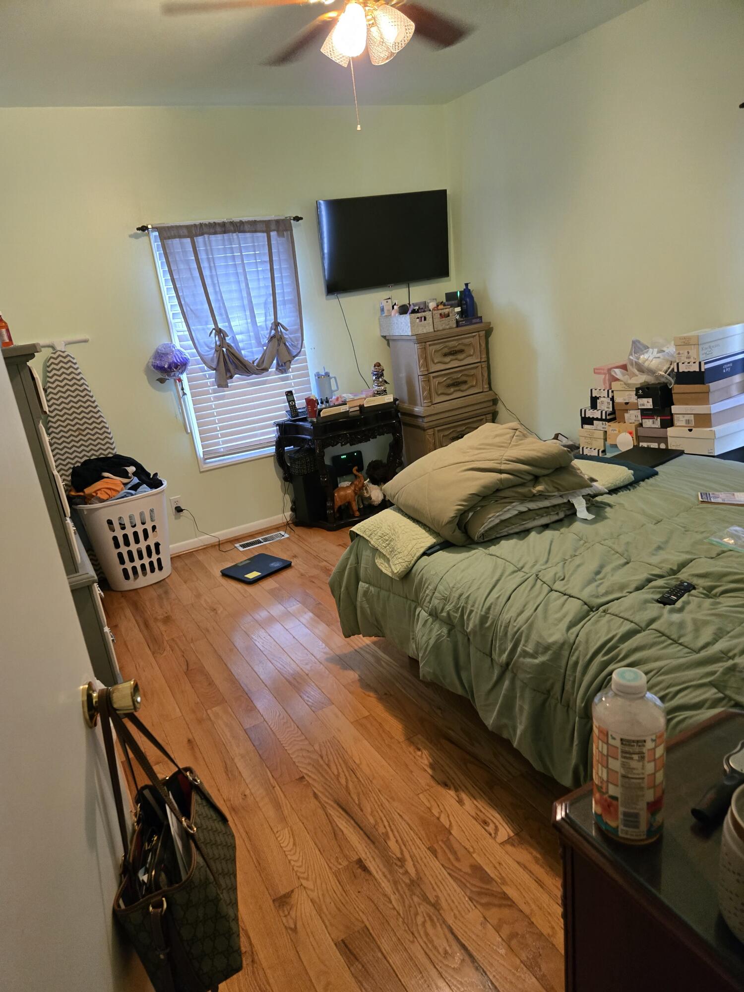 8146 Williamson Road Roanoke, VA 24019 - Photo 8 of 27 a bedroom with a bed and a chandelier