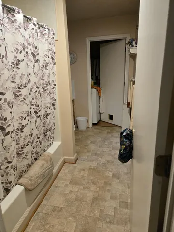 a bedroom with a bed and dresser