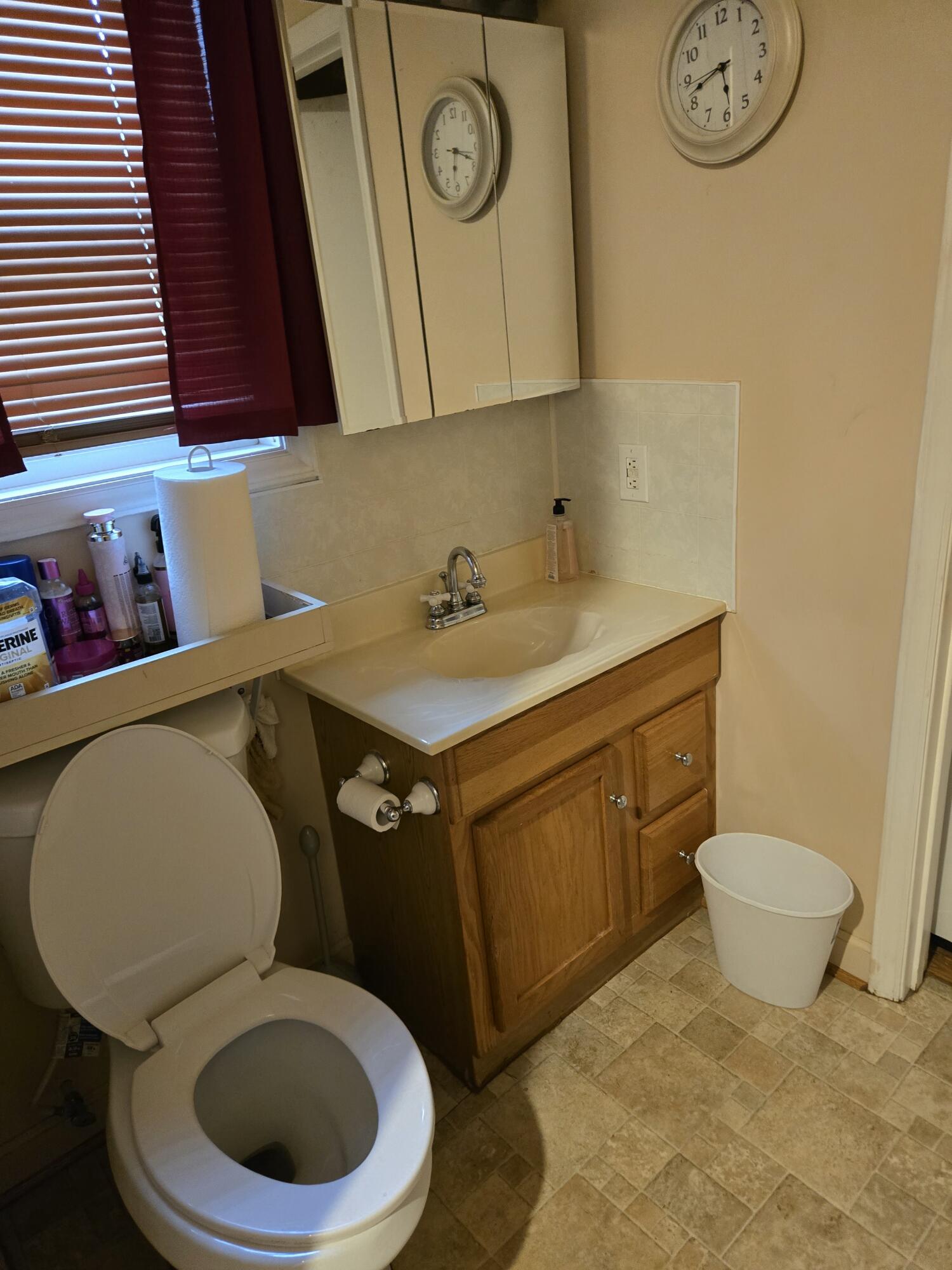 8146 Williamson Road Roanoke, VA 24019 - Photo 10 of 27 a bathroom with a granite countertop toilet sink and mirror