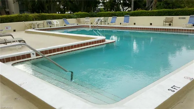 a view of a pool with a yard