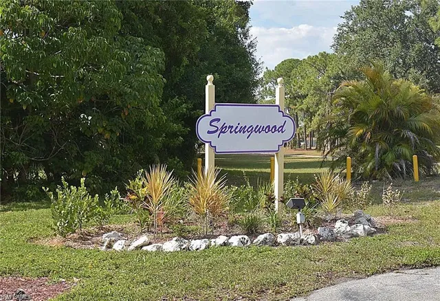 a sign that is sitting in front of a house