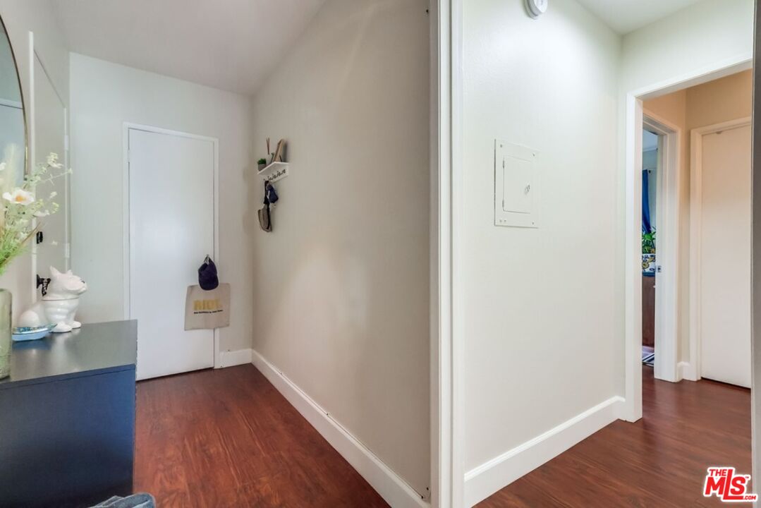3734 South Canfield Avenue, Unit 331 Los Angeles, CA 90034 - Photo 12 of 45 a view of a hallway with wooden floor and closet