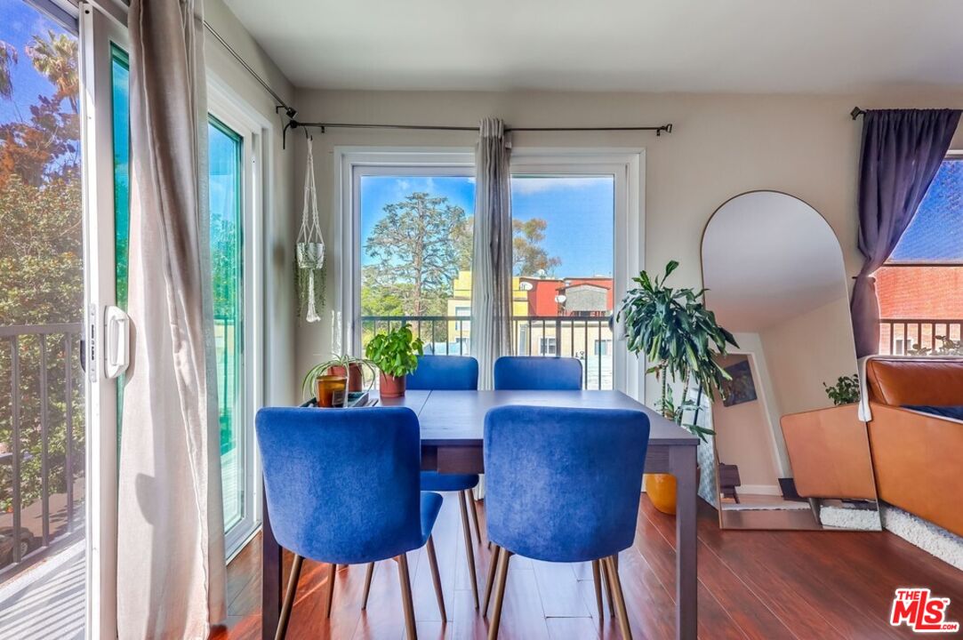 3734 South Canfield Avenue, Unit 331 Los Angeles, CA 90034 - Photo 20 of 45 a view of a dining room with furniture window and wooden floor