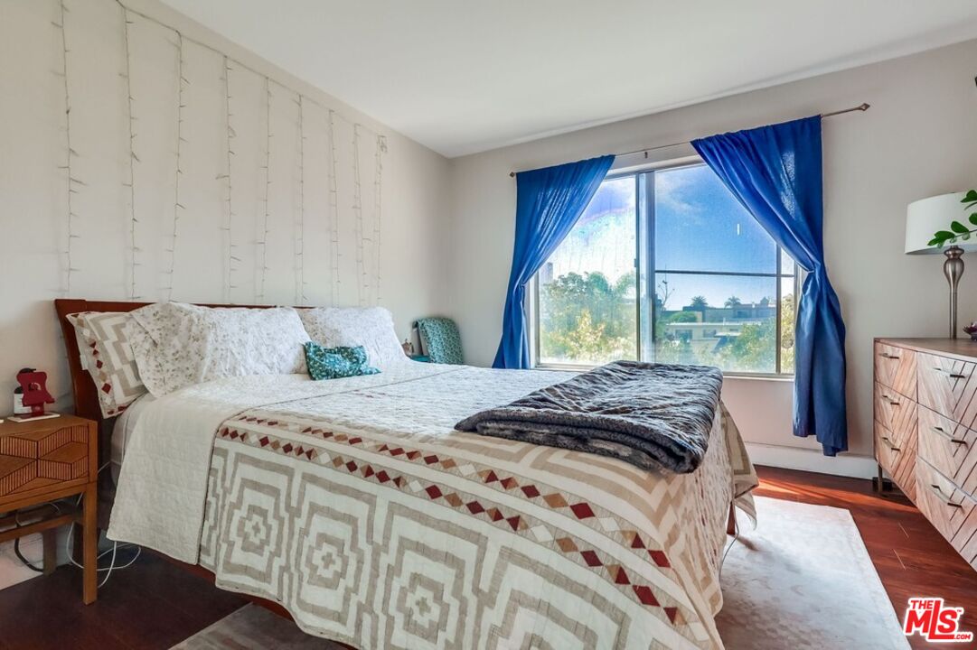3734 South Canfield Avenue, Unit 331 Los Angeles, CA 90034 - Photo 32 of 45 a bedroom with bed and window