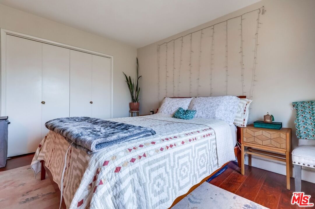 3734 South Canfield Avenue, Unit 331 Los Angeles, CA 90034 - Photo 34 of 45 a bedroom with a bed and a dresser in it