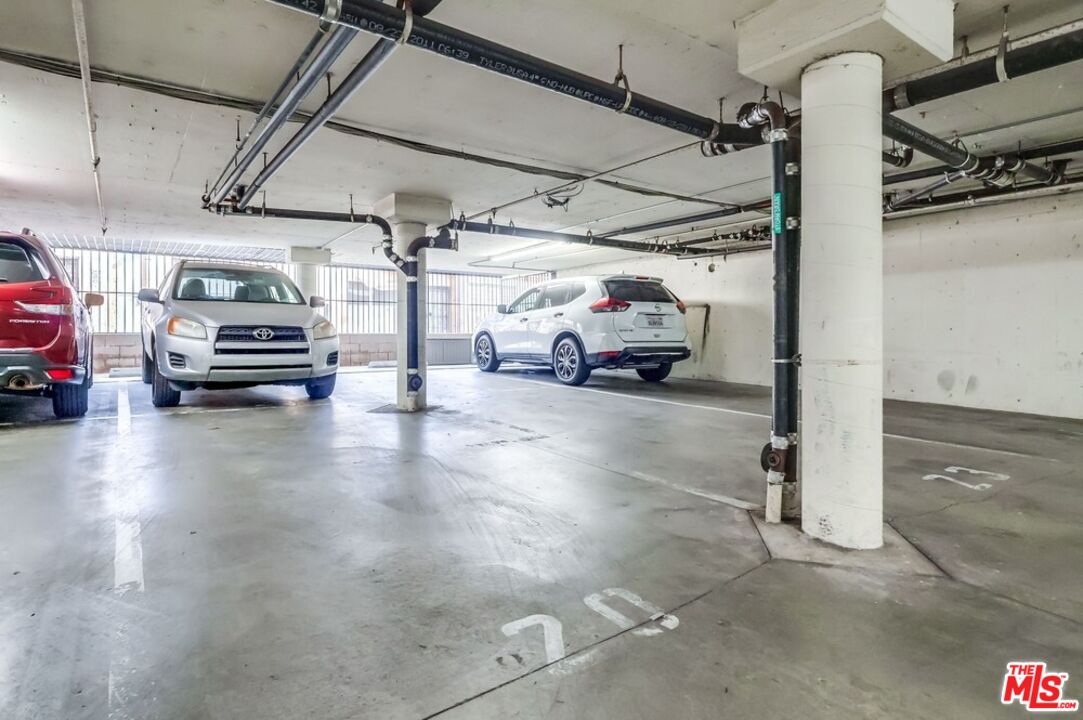 3734 South Canfield Avenue, Unit 331 Los Angeles, CA 90034 - Photo 42 of 45 a view of parking garage with cars parked