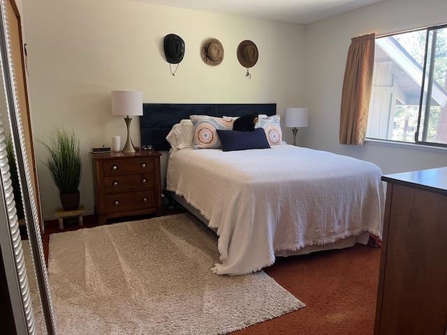 14567 Royal Way Truckee, CA 96161 - Photo 3 of 8 a bedroom with a bed and a window
