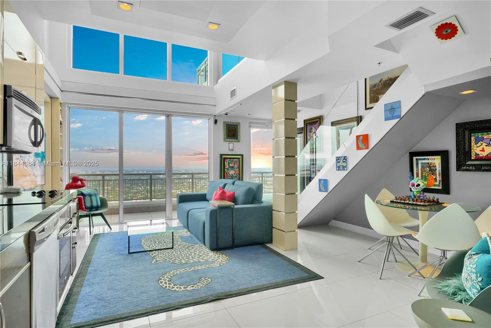 60 Southwest 13th Street, Unit 4411 Miami, FL 33130 - Photo 1 of 38 a living room with furniture and a large window