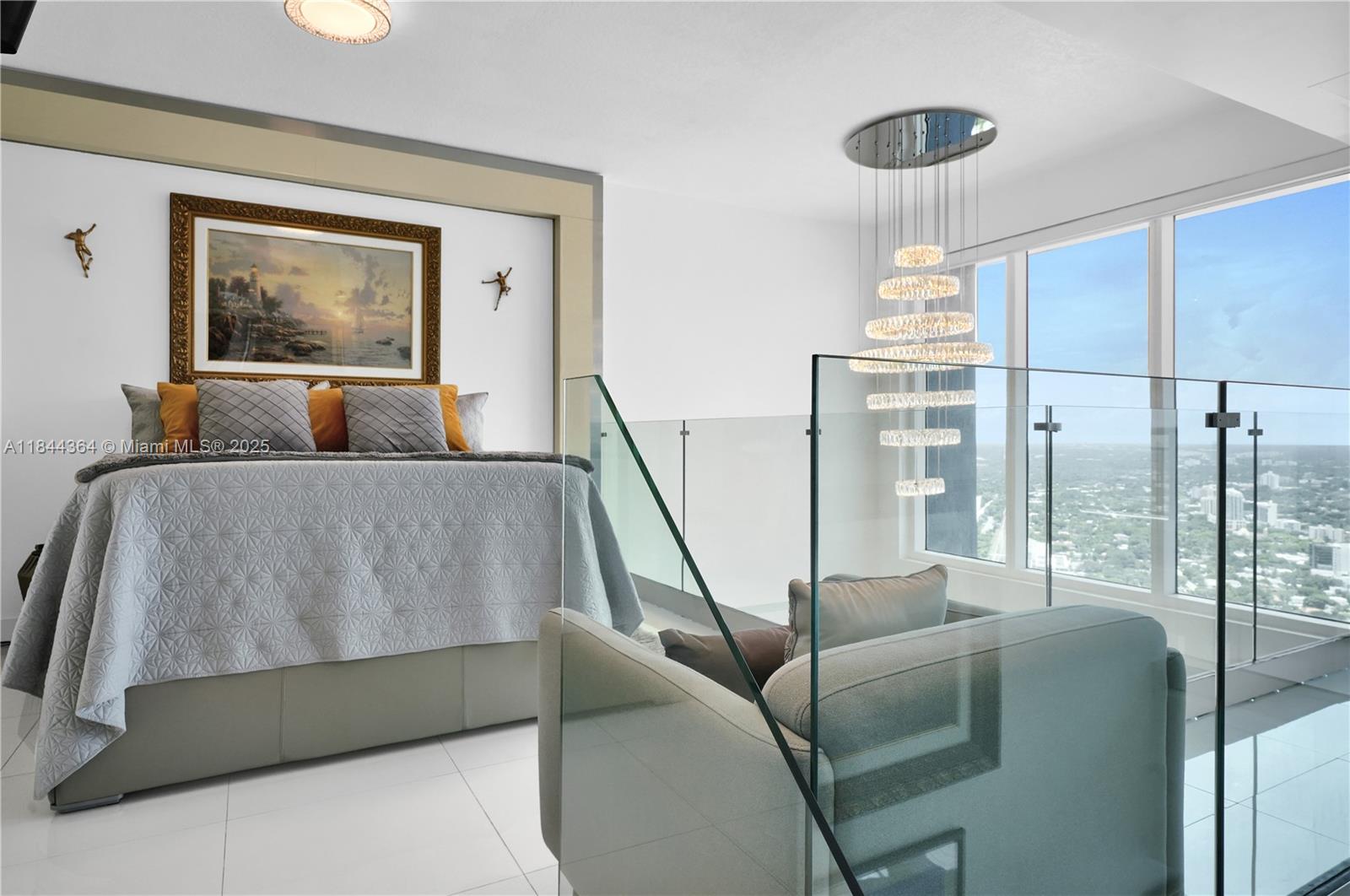 60 Southwest 13th Street, Unit 4411 Miami, FL 33130 - Photo 11 of 38 a living room with furniture and a large window